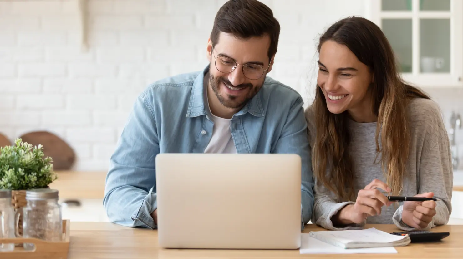 couple reviewing budget and how to save on their electric bills with this list of 89 tips