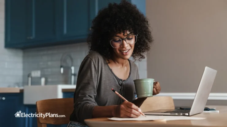 woman calculates how much she can save by switching electricity plans