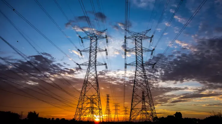 power transmission lines at sunset ancillary services delivery charges