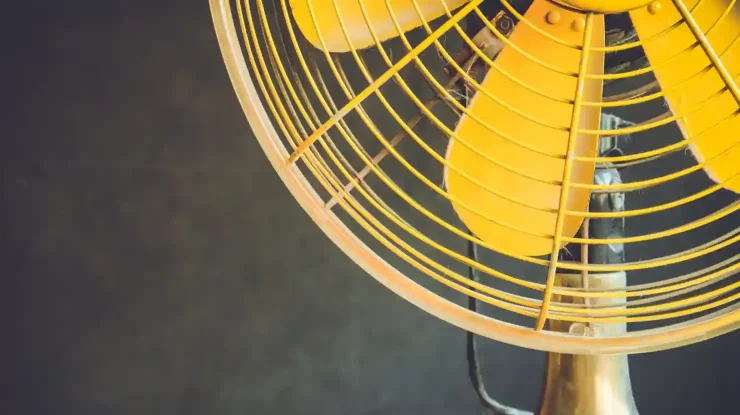 fans vs. air conditioning picture shows yellow fan