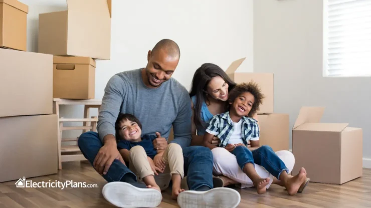 family sits in new apartment before unpacking boxes